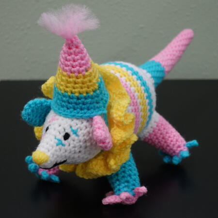 Untitled a crochet possum dressed as a clown