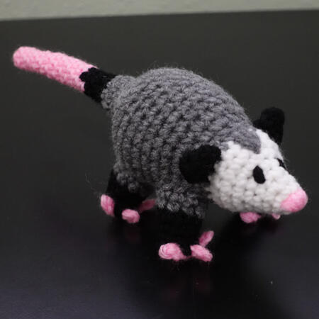 a mini crochet possum